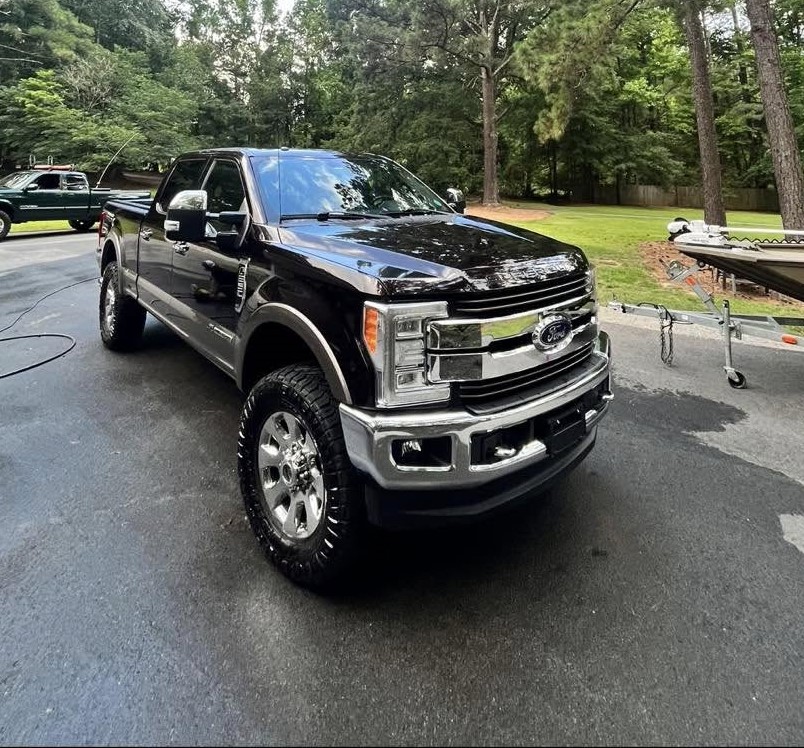 Black Ford Super Duty truck with high-gloss finish